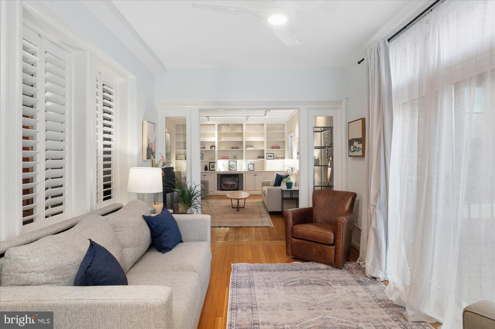 4514 Connecticut Avenue Northwest, Unit 206 Washington, DC 20008 - Photo 13 of 19 a living room with furniture and large windows