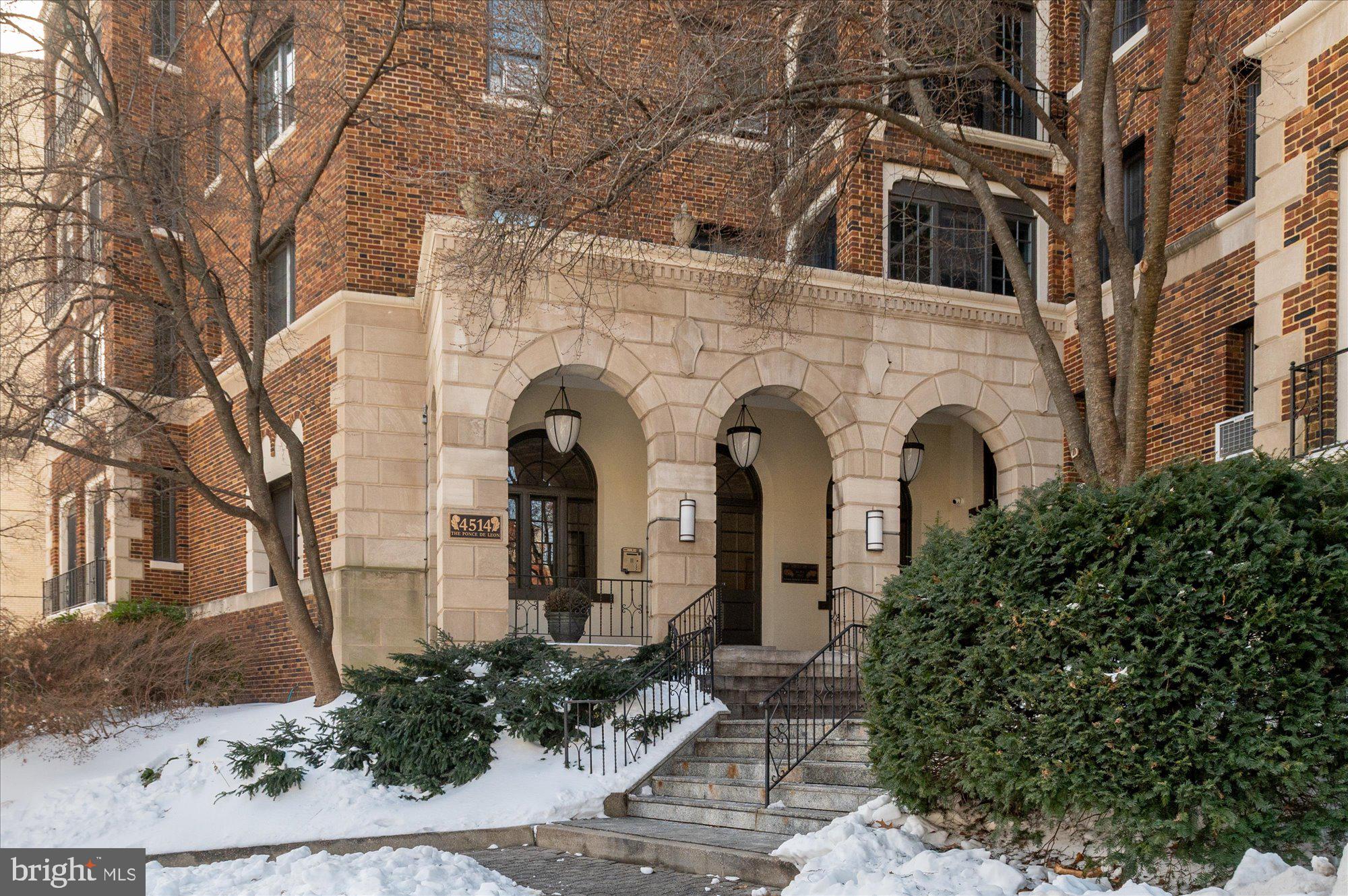 4514 Connecticut Avenue Northwest, Unit 206 Washington, DC 20008 - Photo 2 of 19 a view of a white house with large windows and plants