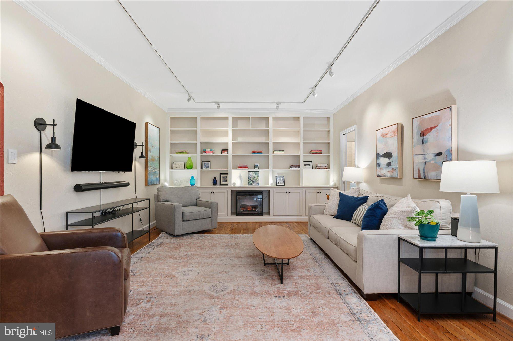 4514 Connecticut Avenue Northwest, Unit 206 Washington, DC 20008 - Photo 5 of 19 a living room with furniture and a flat screen tv