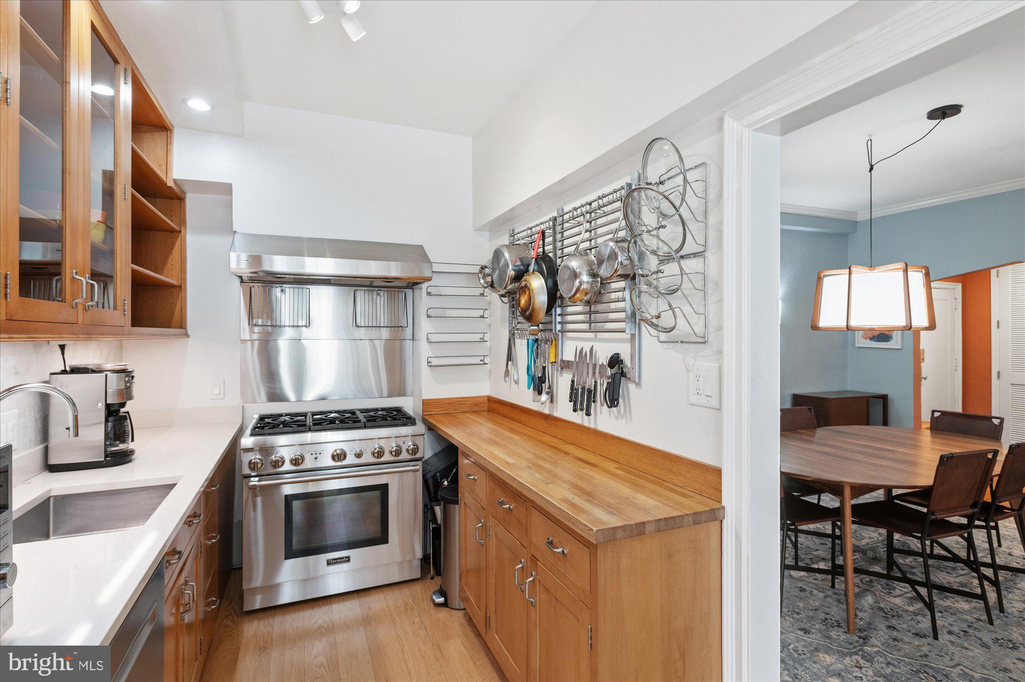4514 Connecticut Avenue Northwest, Unit 206 Washington, DC 20008 - Photo 9 of 19 a kitchen with a stove and a refrigerator