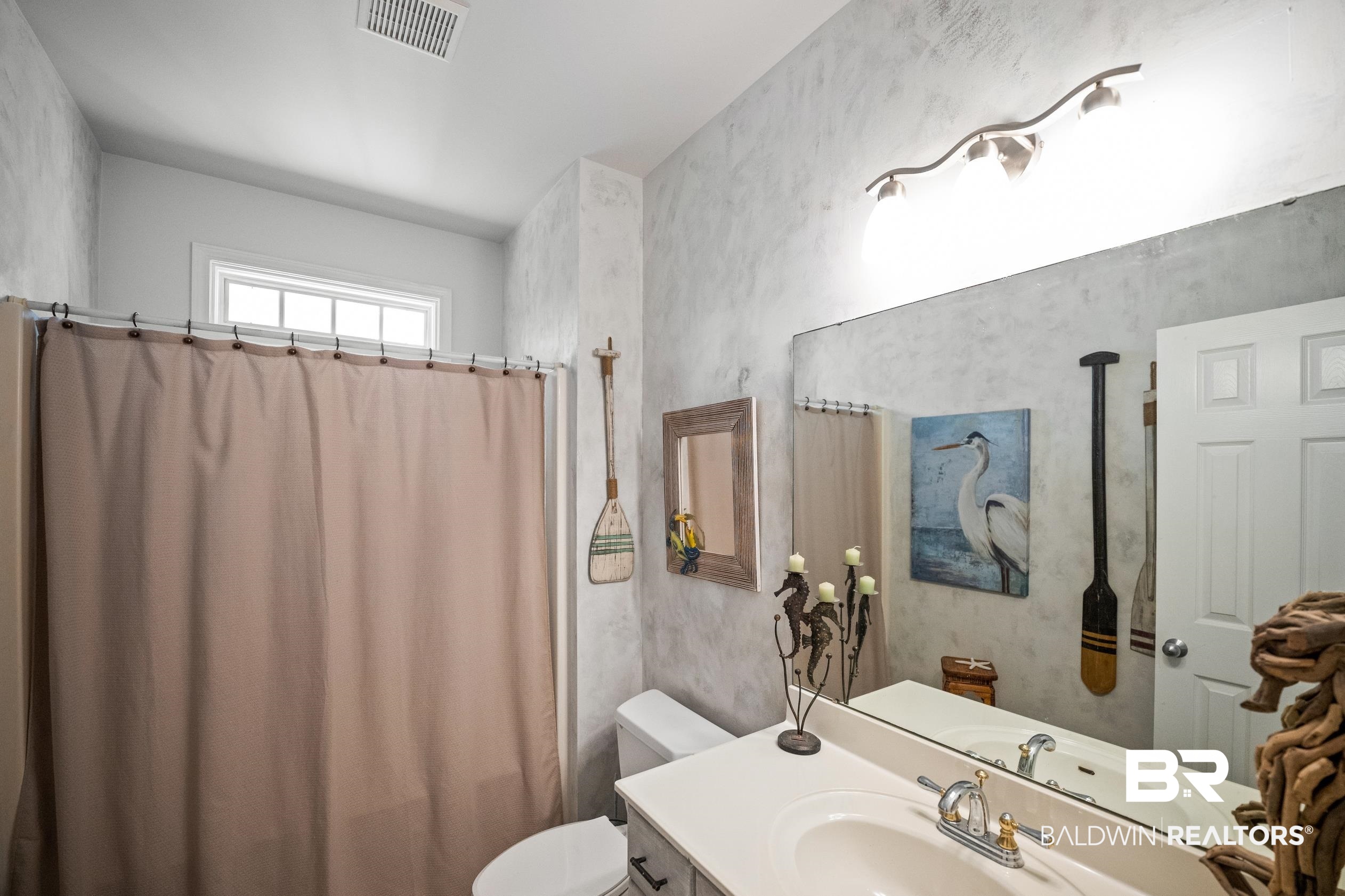 30954 River Road Orange Beach, AL 36561 - Photo 45 of 59 Bathroom with toilet, vanity, and curtained shower