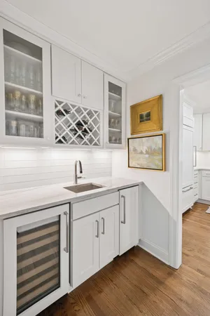 a view of cabinets a wooden floor and a window