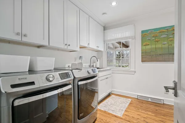 a view of a storage and utility room with washer and dryer