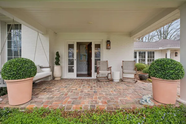 a view of a house with outdoor space and porch