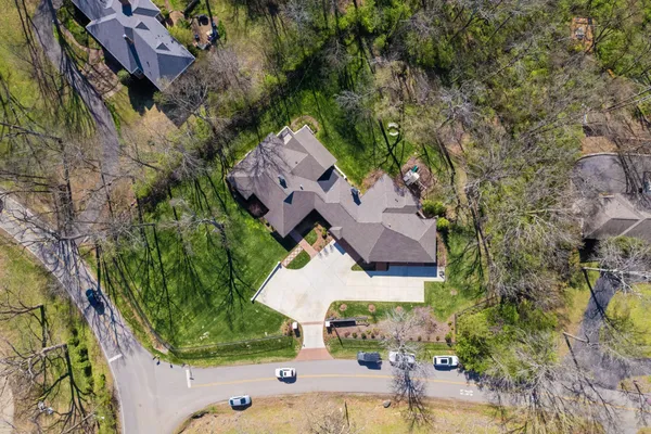 an aerial view of a house with yard swimming pool and outdoor seating