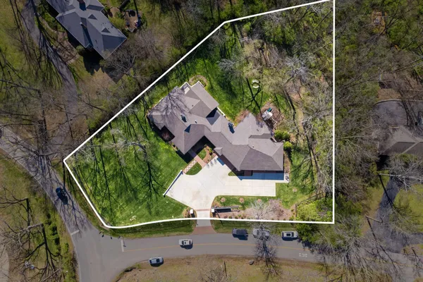 an aerial view of house with yard