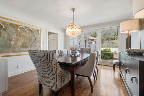a dining room with furniture window wooden floor