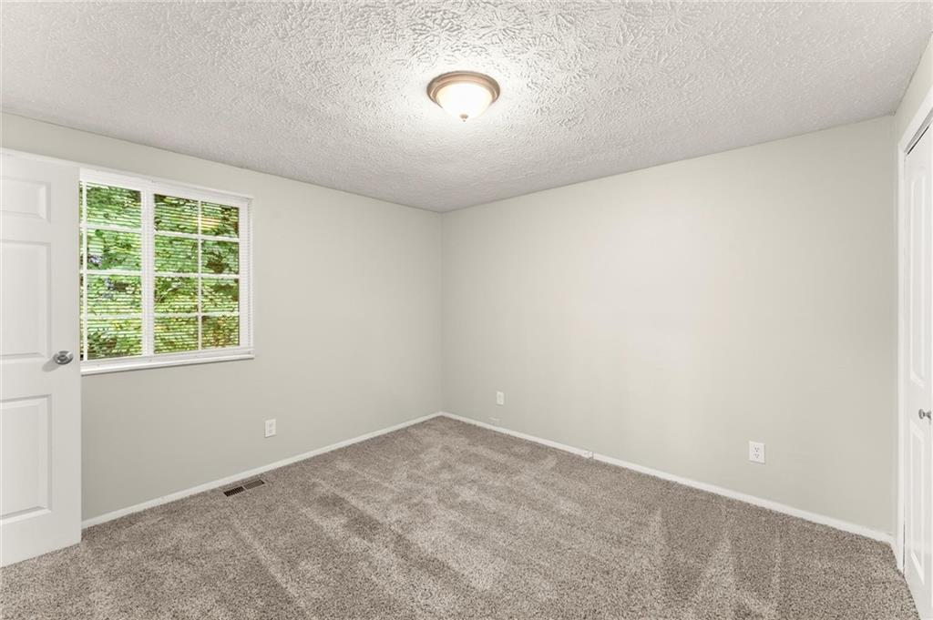 2036 Countydown Lane Stone Mountain, GA 30088 - Photo 14 of 20 an empty room with a window