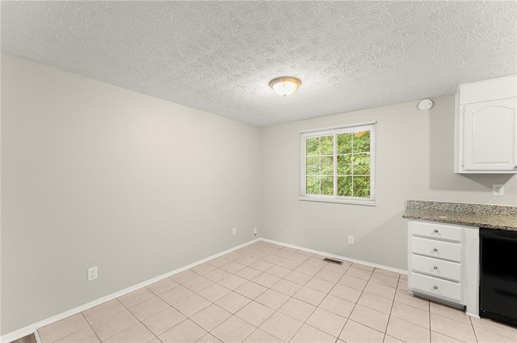 2036 Countydown Lane Stone Mountain, GA 30088 - Photo 6 of 20 an empty room with windows