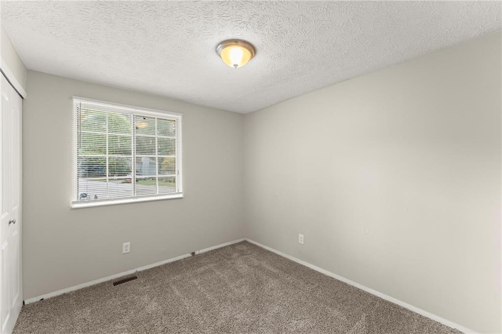 2036 Countydown Lane Stone Mountain, GA 30088 - Photo 10 of 20 an empty room with a window