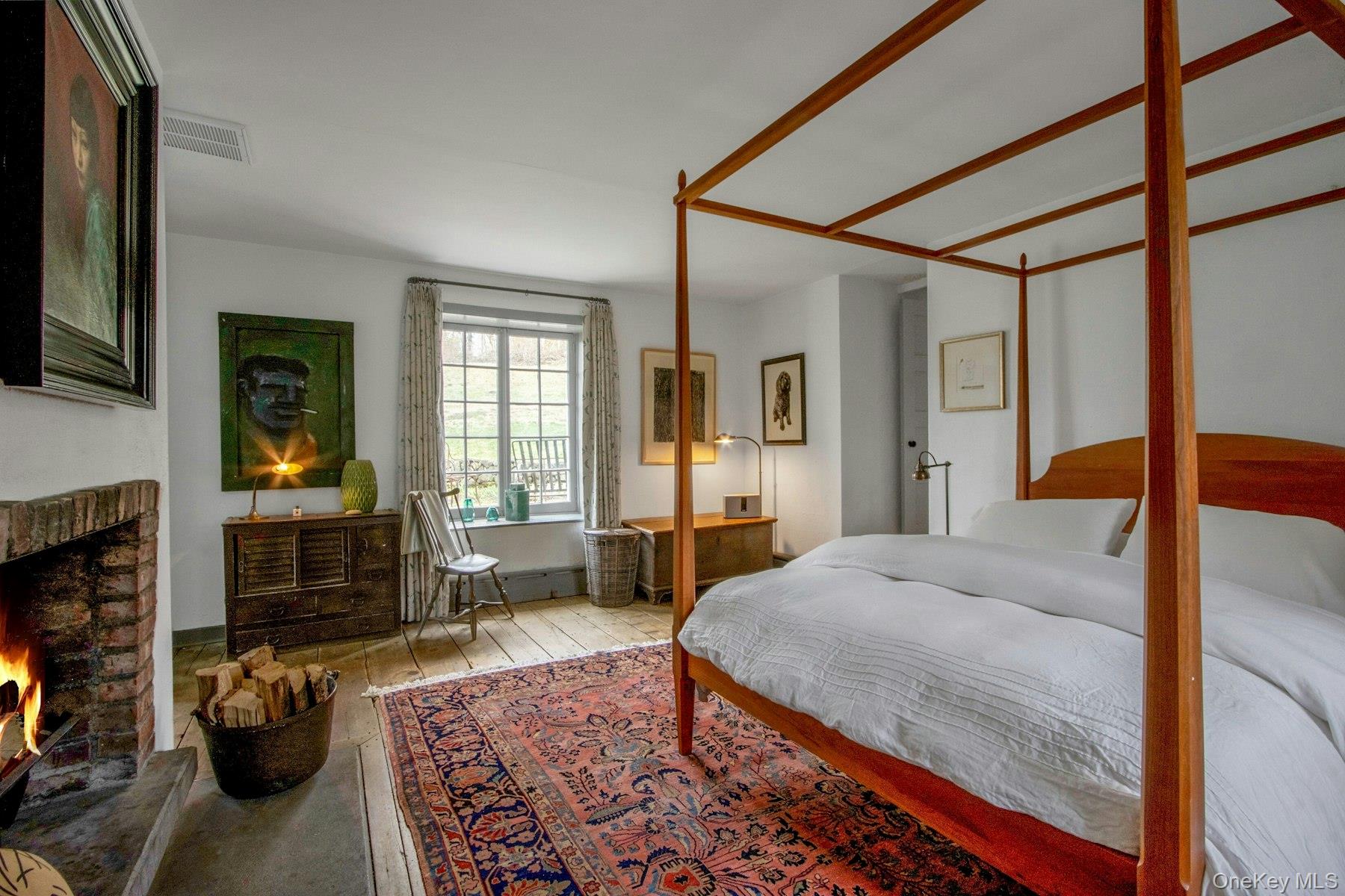 75 Washington Springs Road Palisades, NY 10964 - Photo 19 of 48 a bedroom with a bed and wooden floor