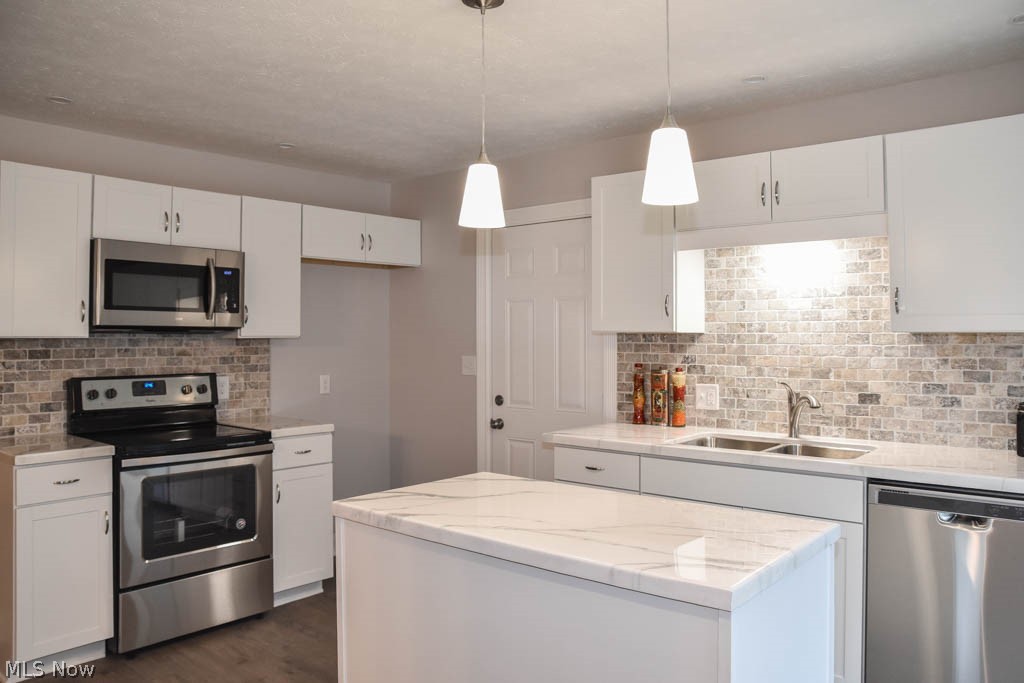 Breathtaking kitchen with new white cabinets and stainless steel appliances!