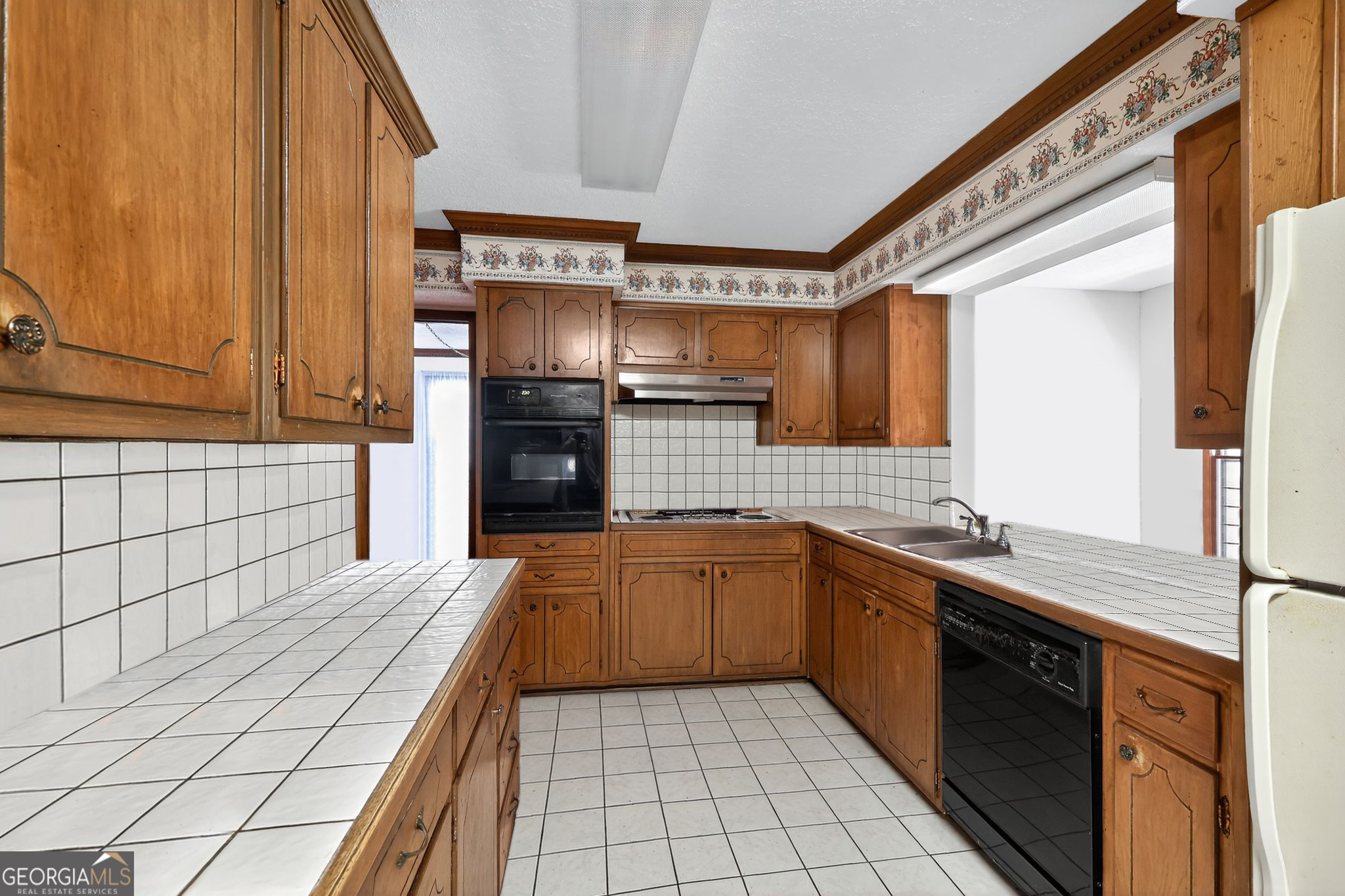 621 Mayes Way Manchester, GA 31816 - Photo 21 of 30 a kitchen with stainless steel appliances granite countertop a sink and cabinets