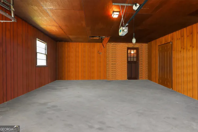 a view of empty room with windows