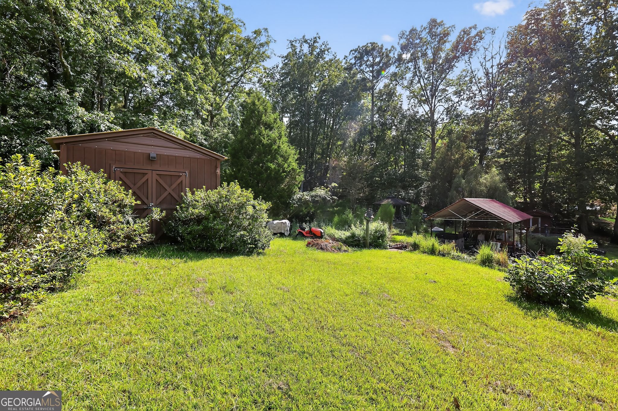 621 Mayes Way Manchester, GA 31816 - Photo 7 of 30 a view of a large garden with large trees and plants