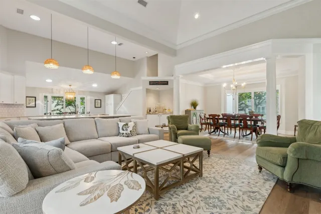 a view of a swimming pool with a lawn chairs under an umbrella