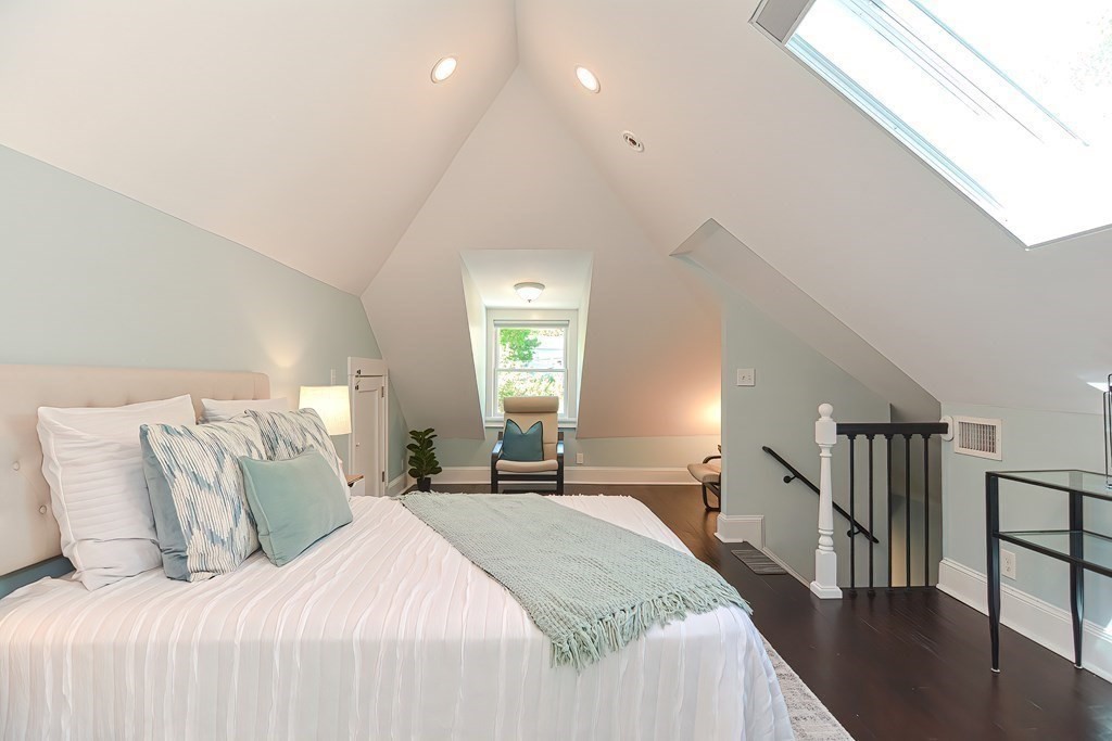 7-9 Goodway Road, Unit 2 Jamaica Plain, MA 02130 - Photo 17 of 39 a bedroom with a bed and a large window