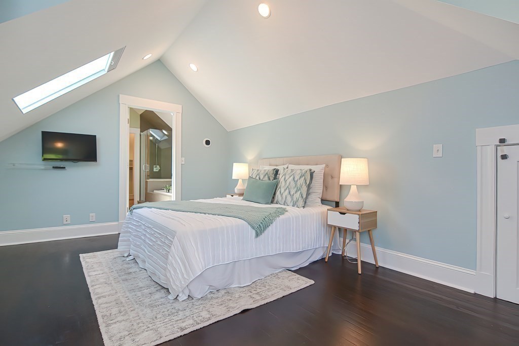 7-9 Goodway Road, Unit 2 Jamaica Plain, MA 02130 - Photo 20 of 39 a bedroom with a bed and a night stand