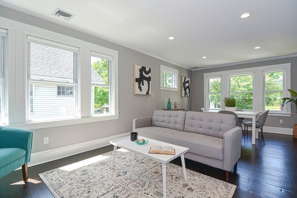 7-9 Goodway Road, Unit 2 Jamaica Plain, MA 02130 - Photo 2 of 39 a living room with furniture and a window