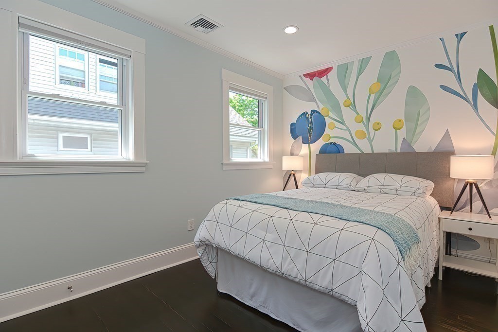 7-9 Goodway Road, Unit 2 Jamaica Plain, MA 02130 - Photo 22 of 39 a bedroom with a bed and a window