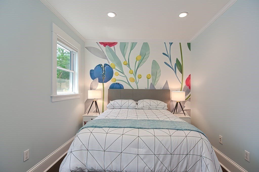 7-9 Goodway Road, Unit 2 Jamaica Plain, MA 02130 - Photo 23 of 39 a bedroom with a bed and a window