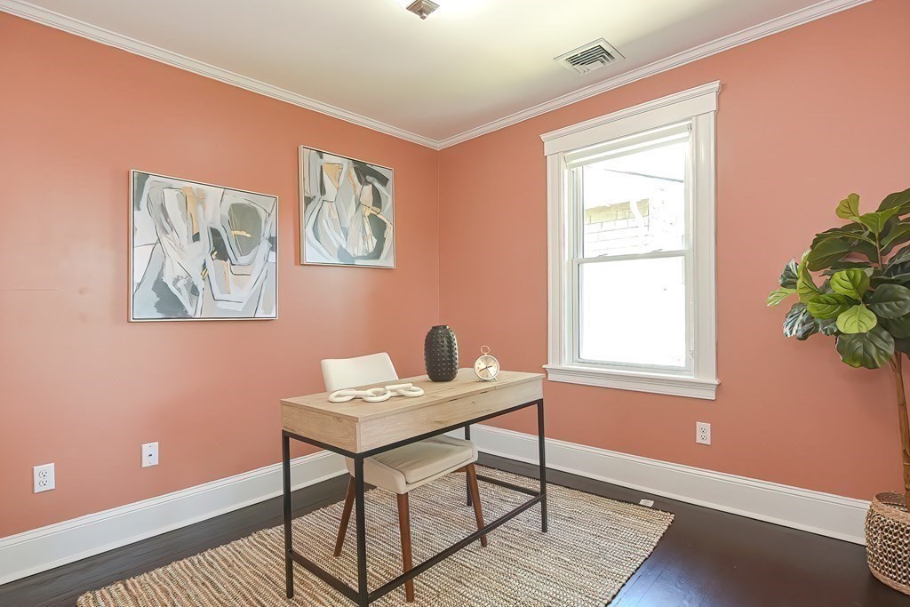 7-9 Goodway Road, Unit 2 Jamaica Plain, MA 02130 - Photo 25 of 39 a workspace with wooden floor and a window