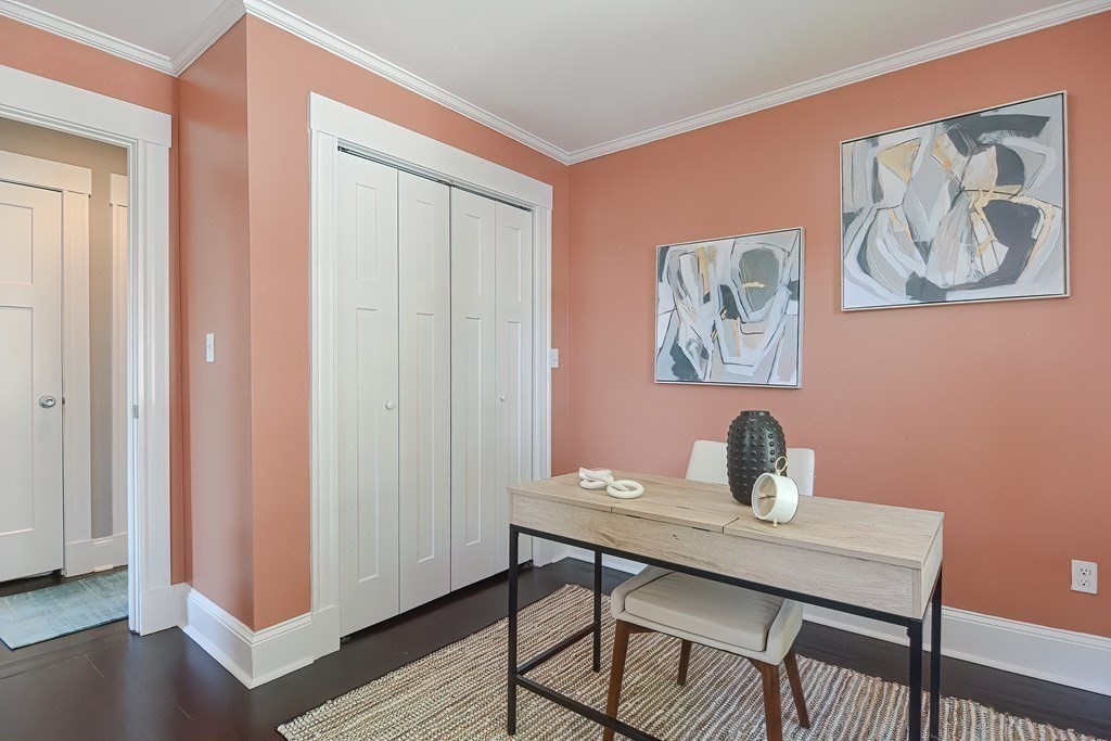 7-9 Goodway Road, Unit 2 Jamaica Plain, MA 02130 - Photo 27 of 39 a view of a dining room with a table and chairs
