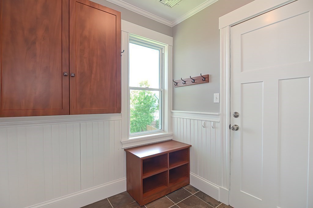 7-9 Goodway Road, Unit 2 Jamaica Plain, MA 02130 - Photo 34 of 39 a room that has a window and a cabinet