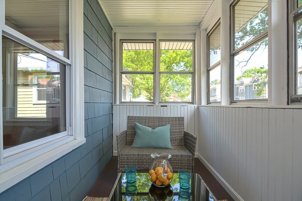 7-9 Goodway Road, Unit 2 Jamaica Plain, MA 02130 - Photo 36 of 39 a wooden bench sitting in front of a window