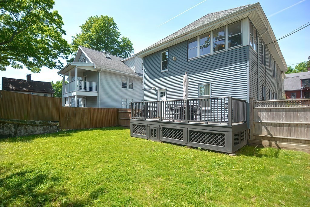 7-9 Goodway Road, Unit 2 Jamaica Plain, MA 02130 - Photo 38 of 39 front view of a house with a yard