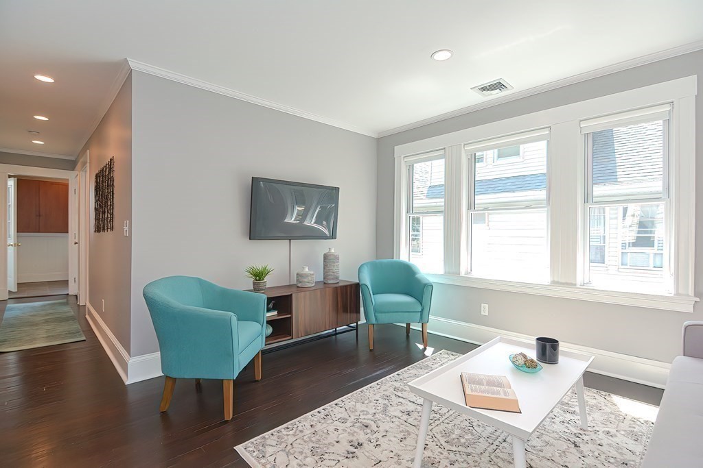 7-9 Goodway Road, Unit 2 Jamaica Plain, MA 02130 - Photo 4 of 39 a living room with furniture and a window