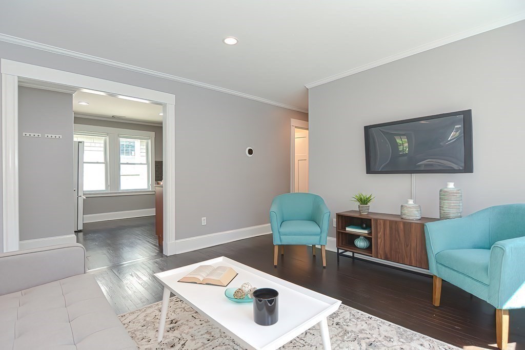 7-9 Goodway Road, Unit 2 Jamaica Plain, MA 02130 - Photo 5 of 39 a living room with furniture and a window