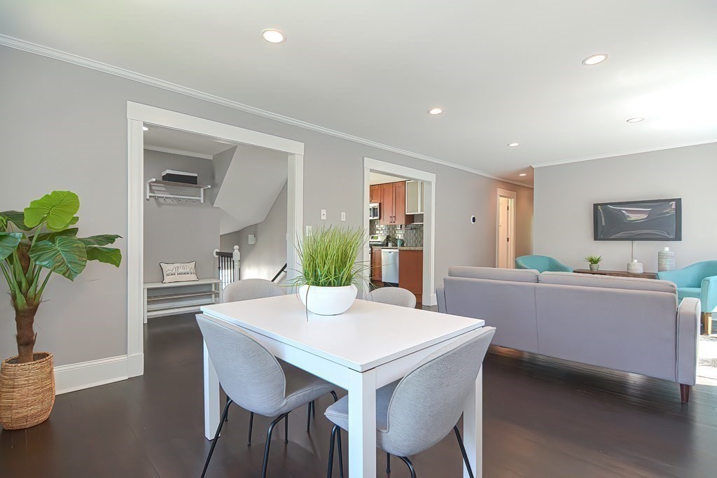 7-9 Goodway Road, Unit 2 Jamaica Plain, MA 02130 - Photo 6 of 39 a view of a dining room with furniture and wooden floor