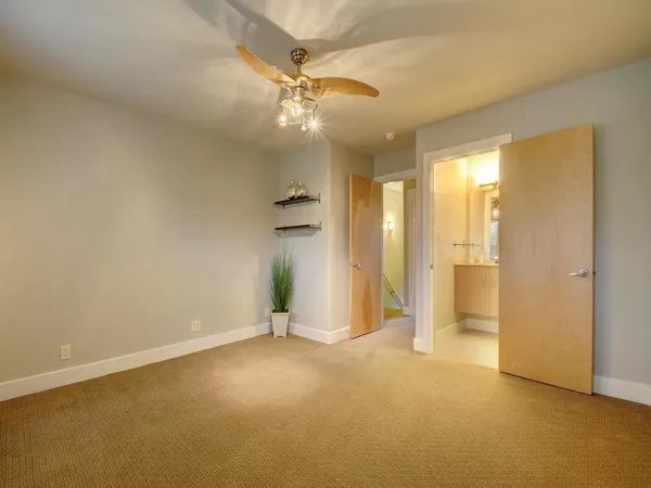 an empty room with a bathroom