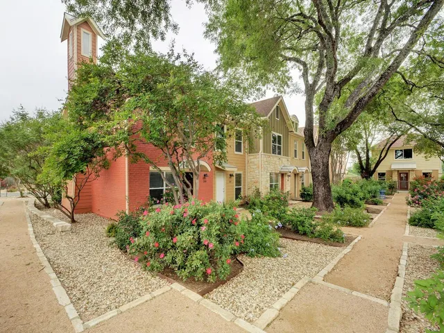 front view of a house with a garden