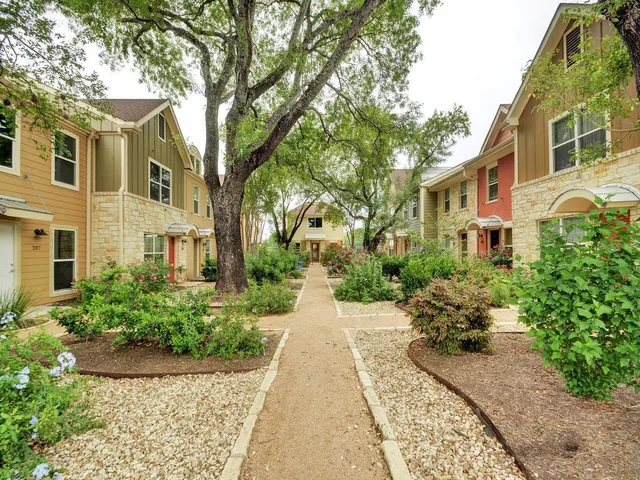 a view of a pathway with a house