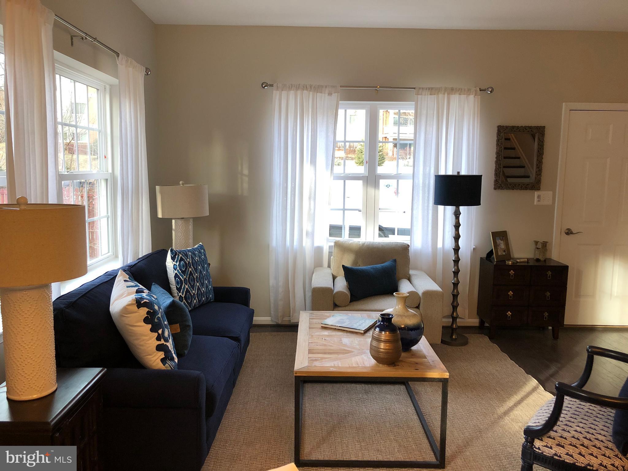 905 Cedarcroft Road Baltimore, MD 21212 - Photo 11 of 28 a living room with furniture window and a table
