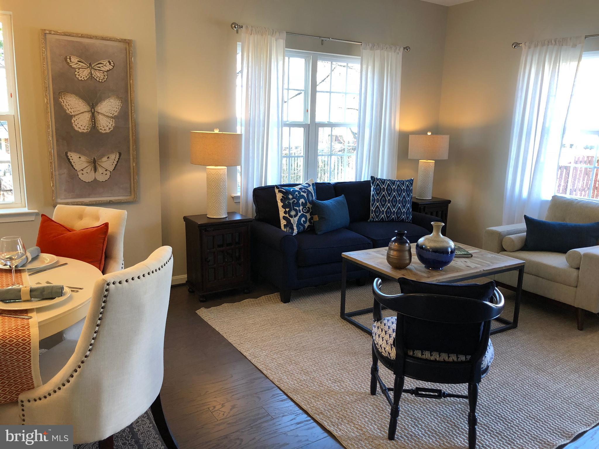 905 Cedarcroft Road Baltimore, MD 21212 - Photo 12 of 28 a living room with furniture and a large window