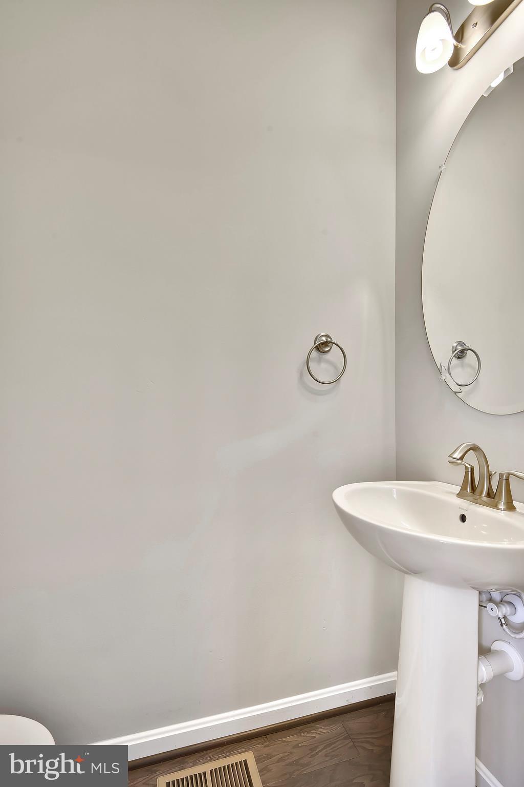905 Cedarcroft Road Baltimore, MD 21212 - Photo 15 of 28 a bathroom with a sink and mirror