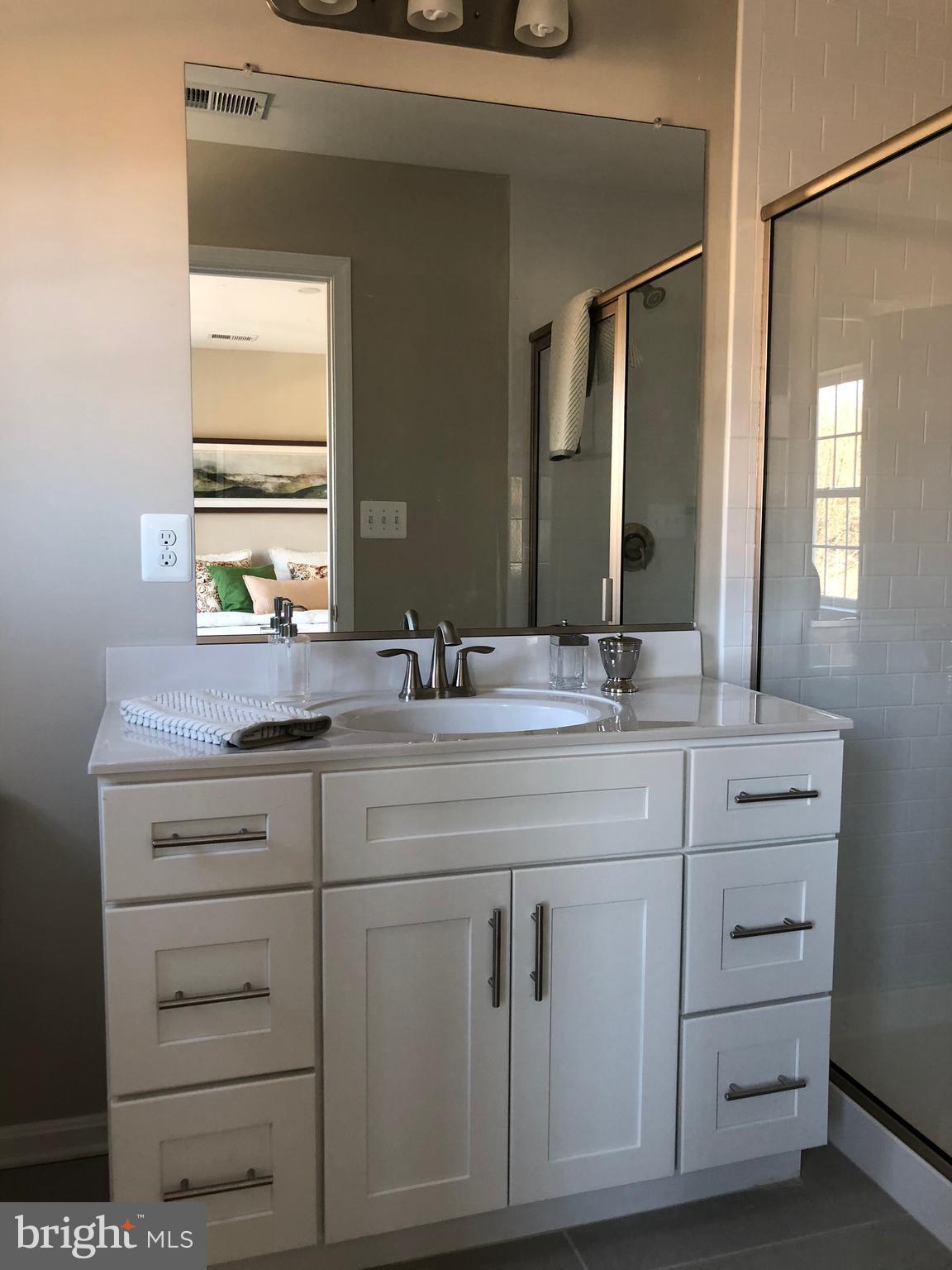 905 Cedarcroft Road Baltimore, MD 21212 - Photo 17 of 28 a bathroom with a sink vanity and mirror