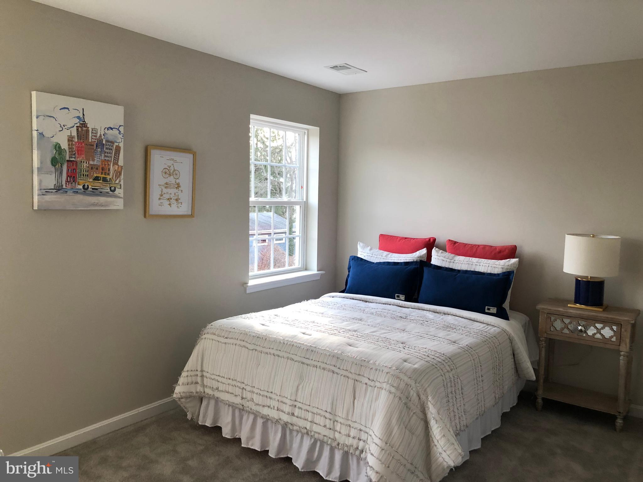 905 Cedarcroft Road Baltimore, MD 21212 - Photo 18 of 28 a bedroom with a bed and a window