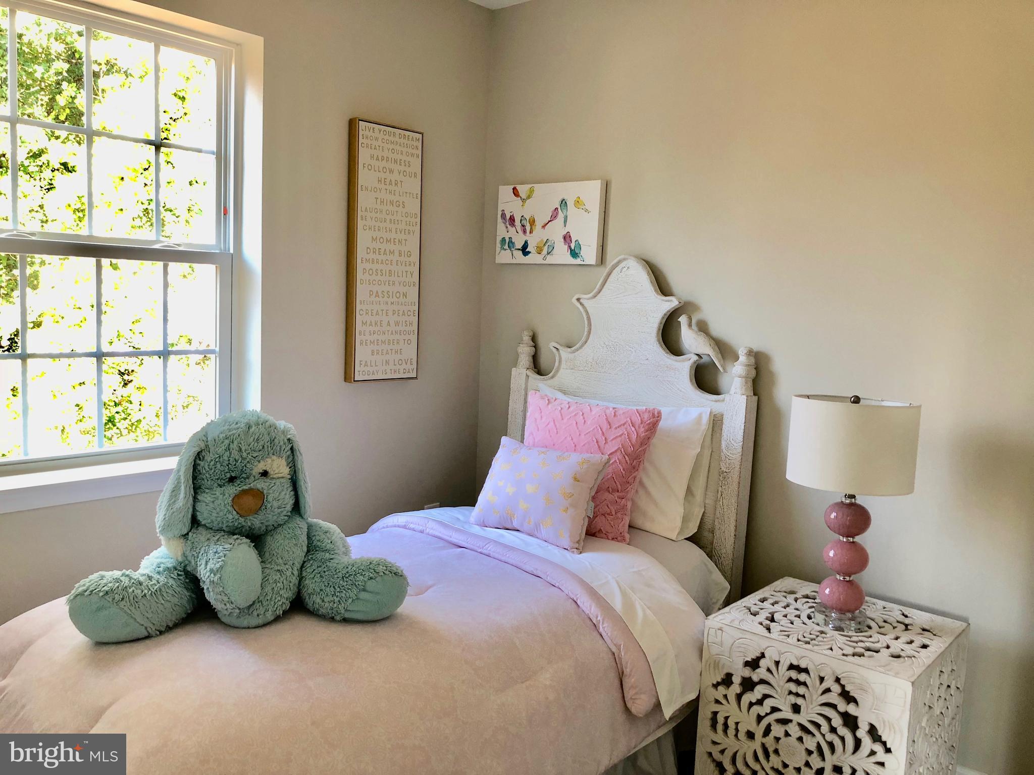 905 Cedarcroft Road Baltimore, MD 21212 - Photo 19 of 28 a bedroom with a bed and a window