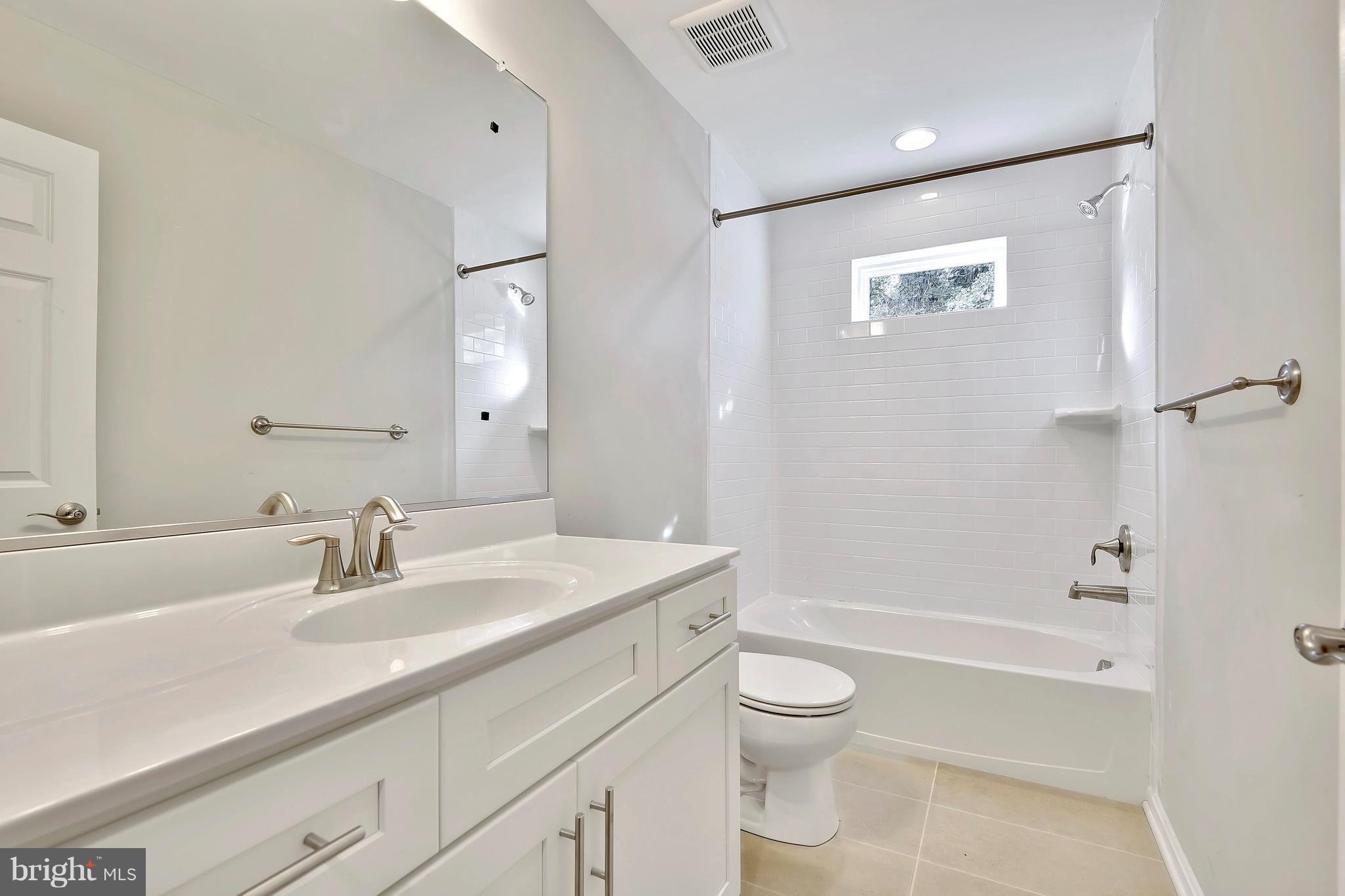 905 Cedarcroft Road Baltimore, MD 21212 - Photo 20 of 28 a bathroom with a sink a toilet and shower