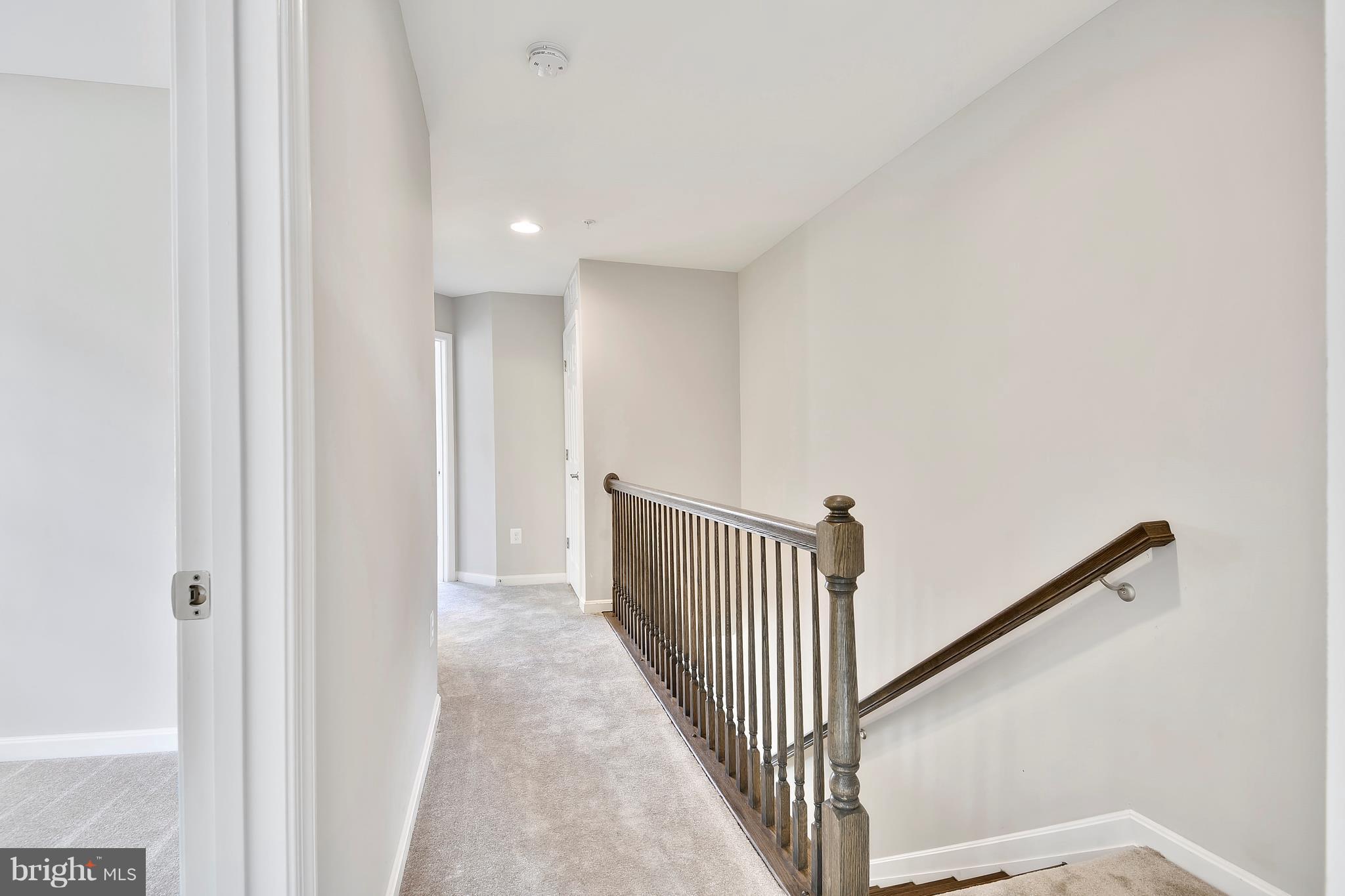 905 Cedarcroft Road Baltimore, MD 21212 - Photo 21 of 28 a view of a hallway with wooden floor and entryway
