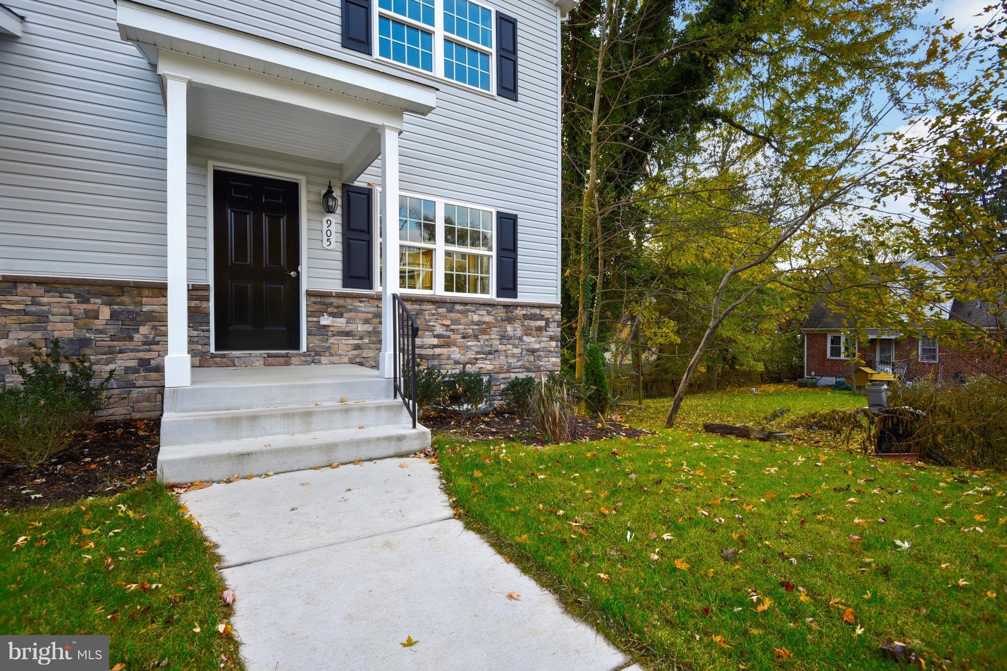 905 Cedarcroft Road Baltimore, MD 21212 - Photo 25 of 28 a front view of a house with garden