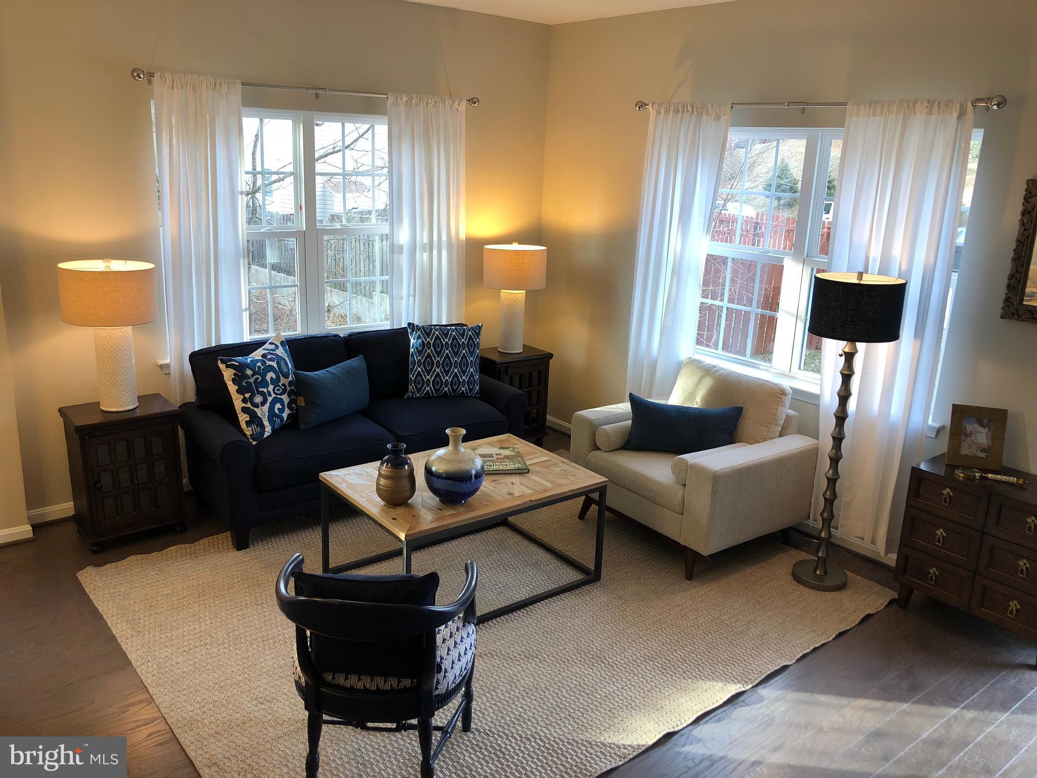 905 Cedarcroft Road Baltimore, MD 21212 - Photo 8 of 28 a living room with furniture and a large window