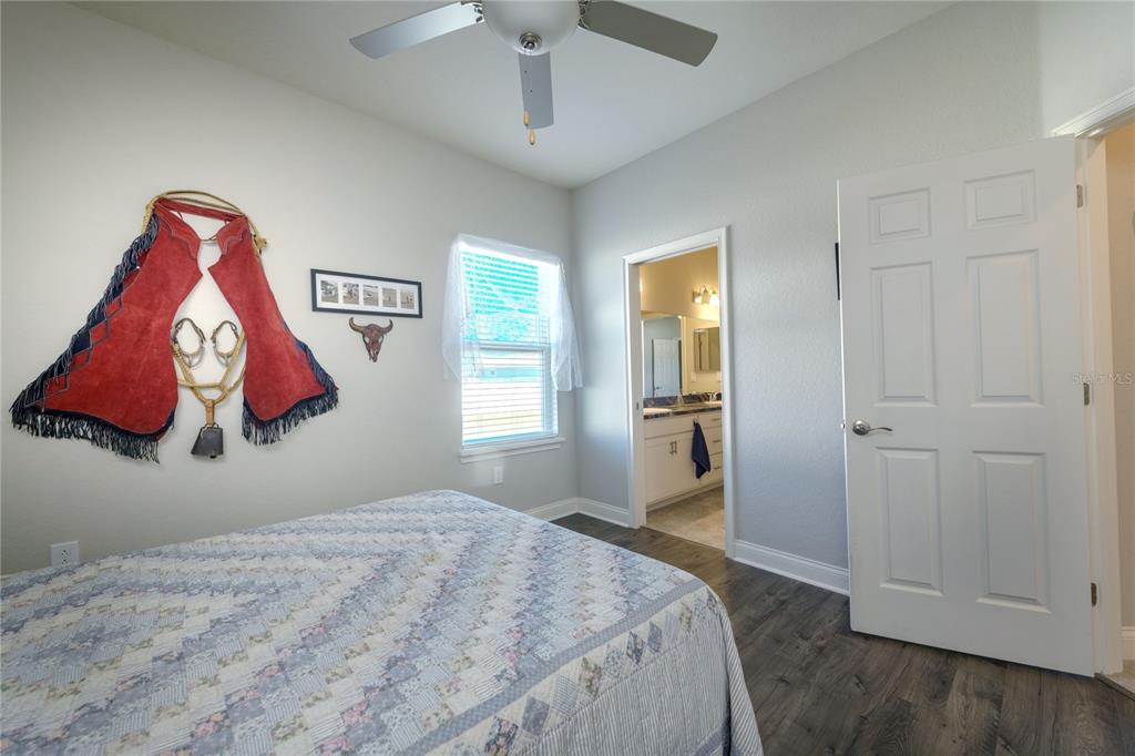 4444 Devinshire Fields Loop Plant City, FL 33567 - Photo 19 of 38 a bedroom with a bed and a window