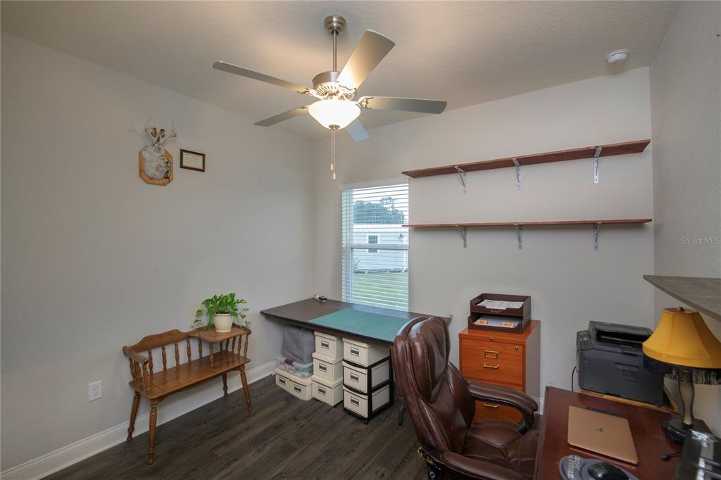4444 Devinshire Fields Loop Plant City, FL 33567 - Photo 23 of 38 a view of a workspace with furniture and wooden floor