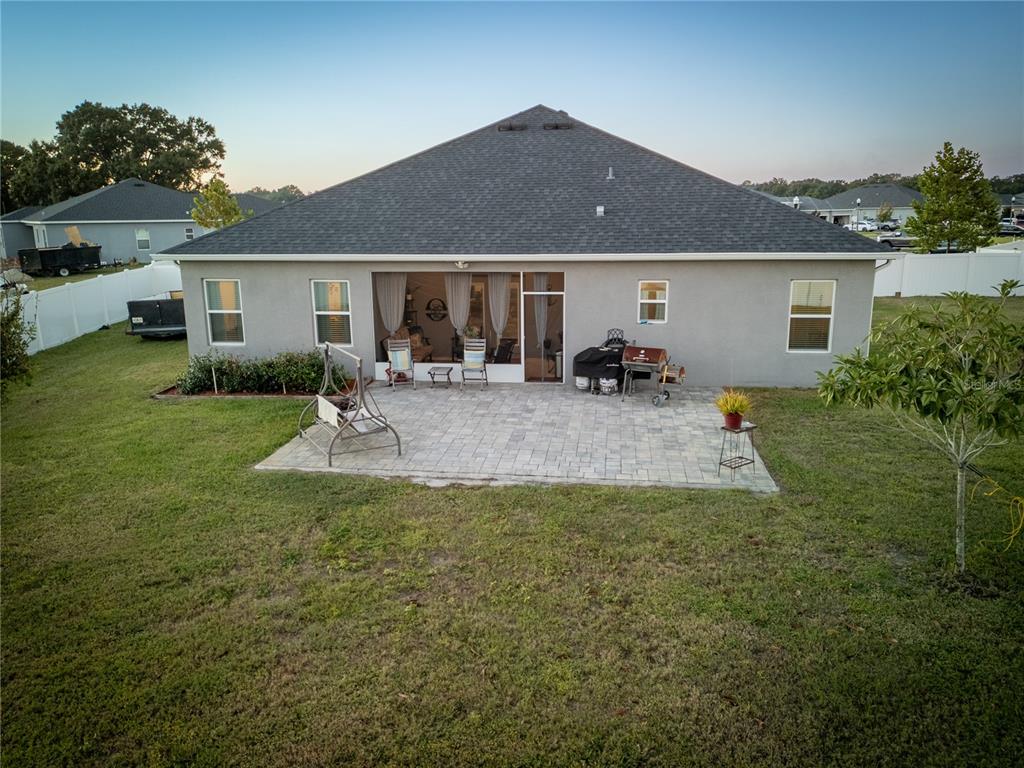 4444 Devinshire Fields Loop Plant City, FL 33567 - Photo 31 of 38 a view of a house with backyard and sitting area