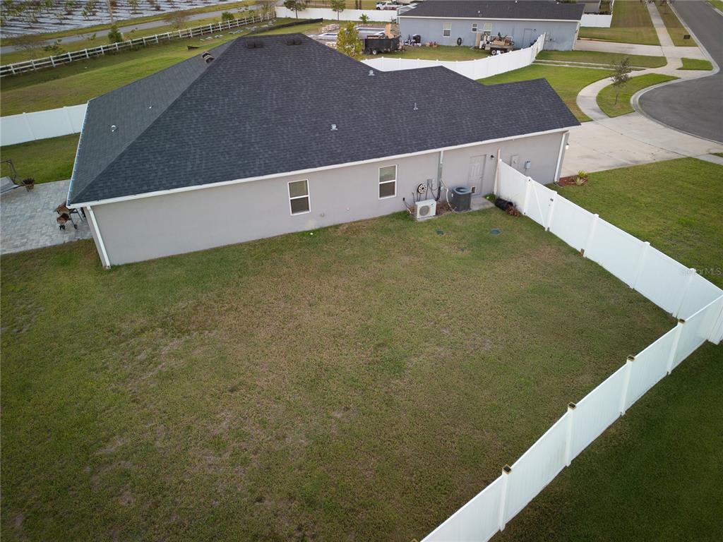 4444 Devinshire Fields Loop Plant City, FL 33567 - Photo 35 of 38 a view of a big yard with an outdoor space